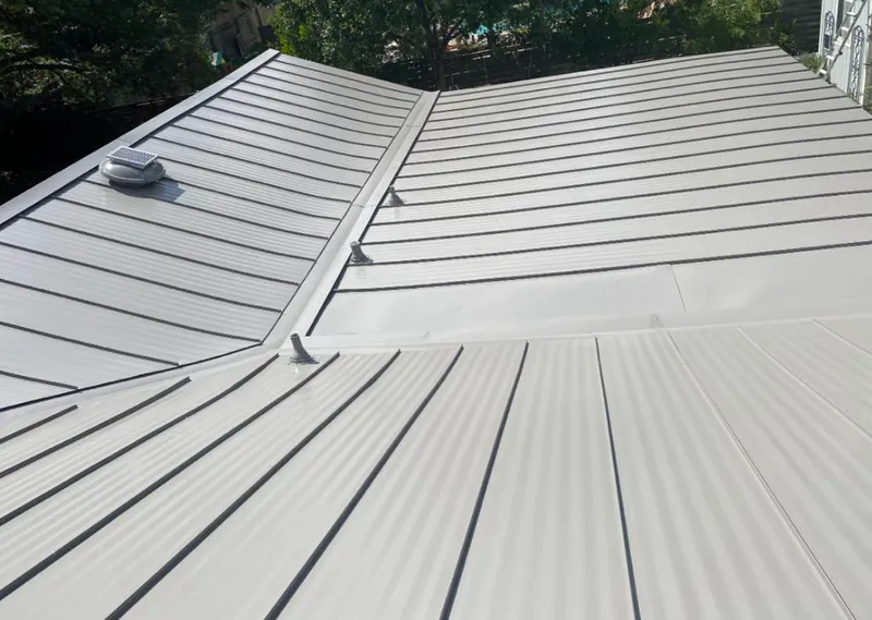 Solar attic fan installed on a metal roof for Roof Ventilation in Boise City